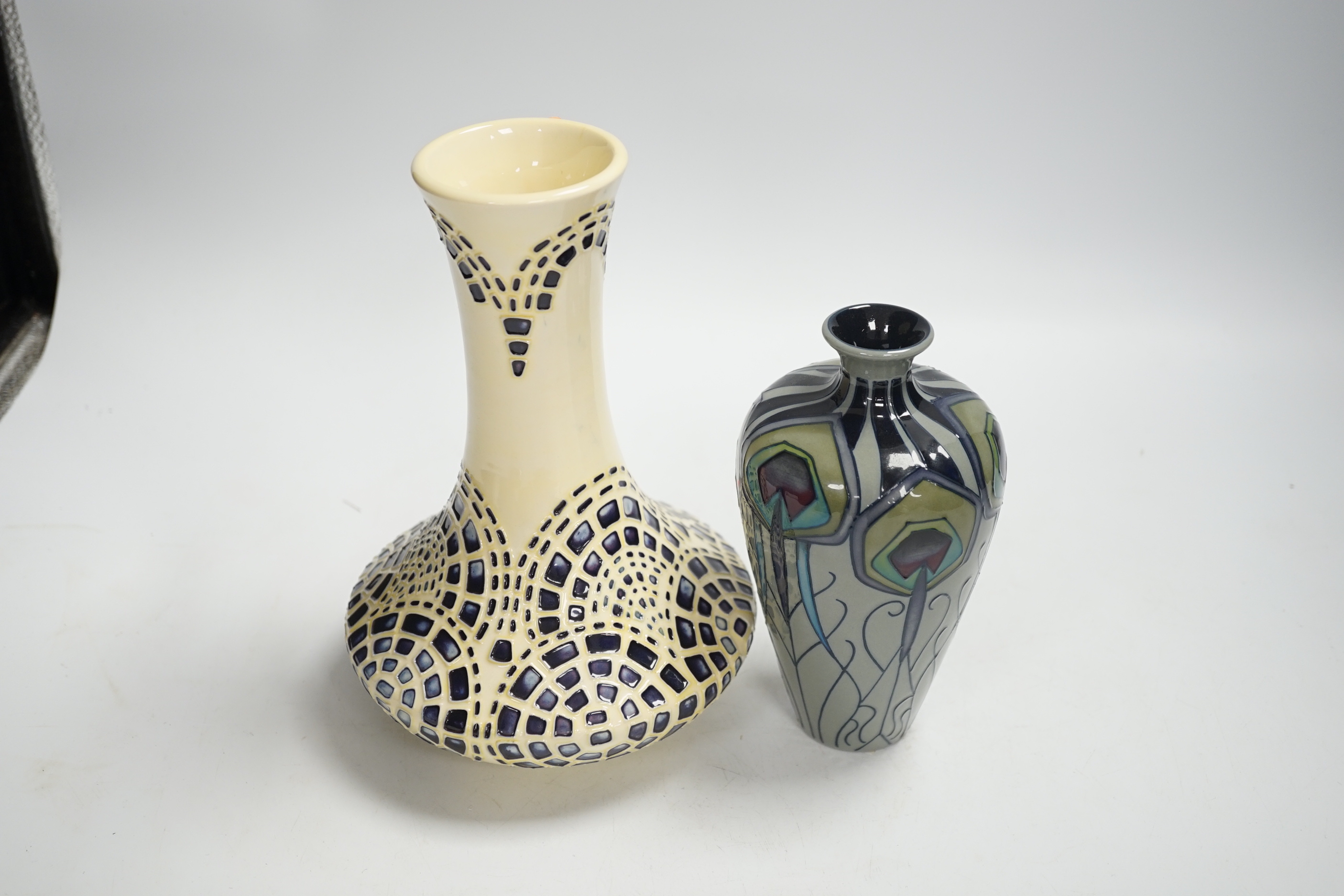 A Moorcroft ‘Peacock Parade’ vase and a Moorcroft secessionist style vase, largest 21cm high